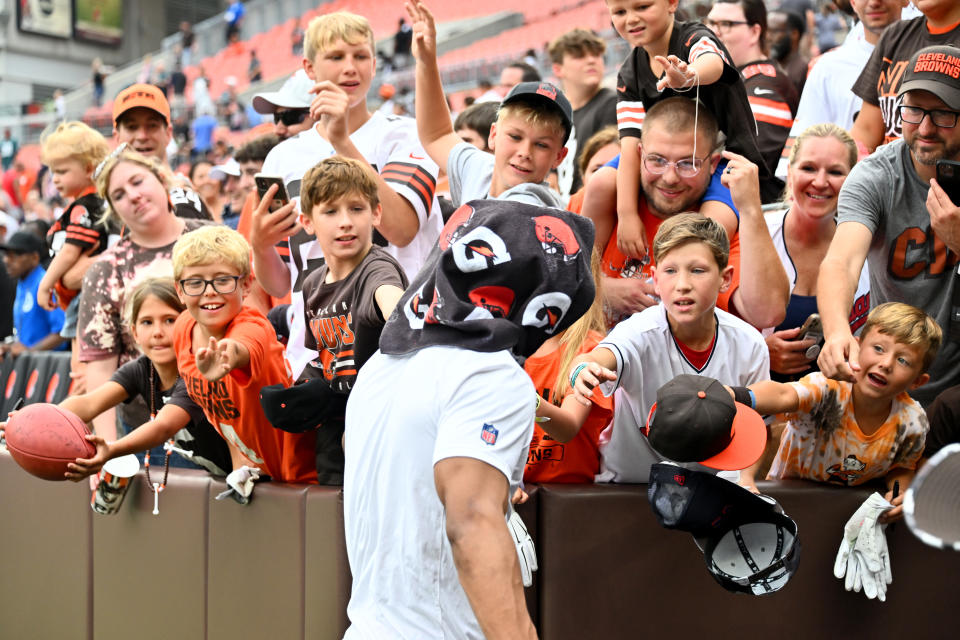 CLEVELAND, OHIO - AUGUST 21: Cleveland Browns fans try to get an autograph from a player after a preseason game against the Philadelphia Eagles at FirstEnergy Stadium on August 21, 2022 in Cleveland, Ohio.  The Eagles defeated the Browns 21-20.  (Photo by Jason Miller/Getty Images)