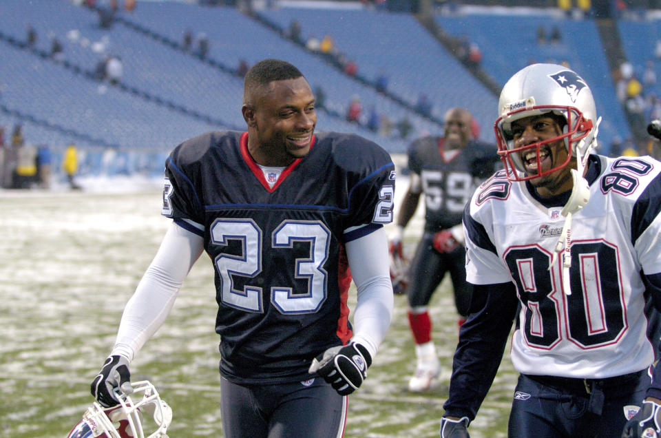 Buffalo Bills quarterback Troy Vincent (23) and New England Patriots wide receiver Troy Brown (80) walk off the field together at Ralph Wilson Stadium in Orchard Park, New York on December 11, 2005. New England won the game 35-7.  (Photo by Mark Konezny/Getty Images)