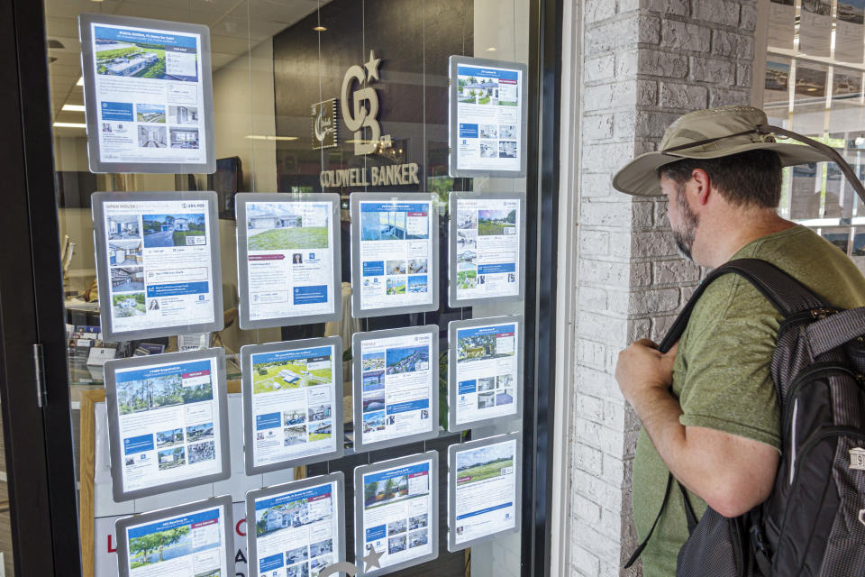 Punta Gorda, Florida, Coldwell Banker, real estate office, man looking at property listings and homes for sale.  (Photo: Jeffrey Greenberg/Universal Images Group via Getty Images)