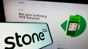 Mobile phone with the logo of the Brazilian fintech company Stone Company (StoneCo) on the screen in front of the website