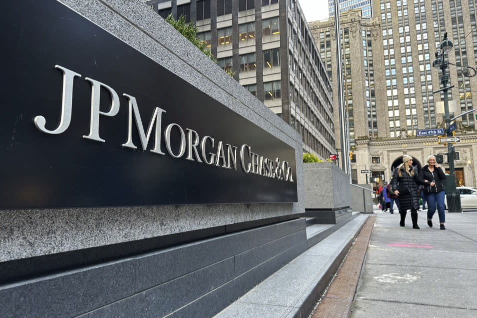 FILE - Pedestrians approach JPMorgan Chase headquarters on Dec. 29, 2023, in New York.  JP Morgan reports earnings on Friday, April 12, 2024. (AP Photo/Peter Morgan, File)