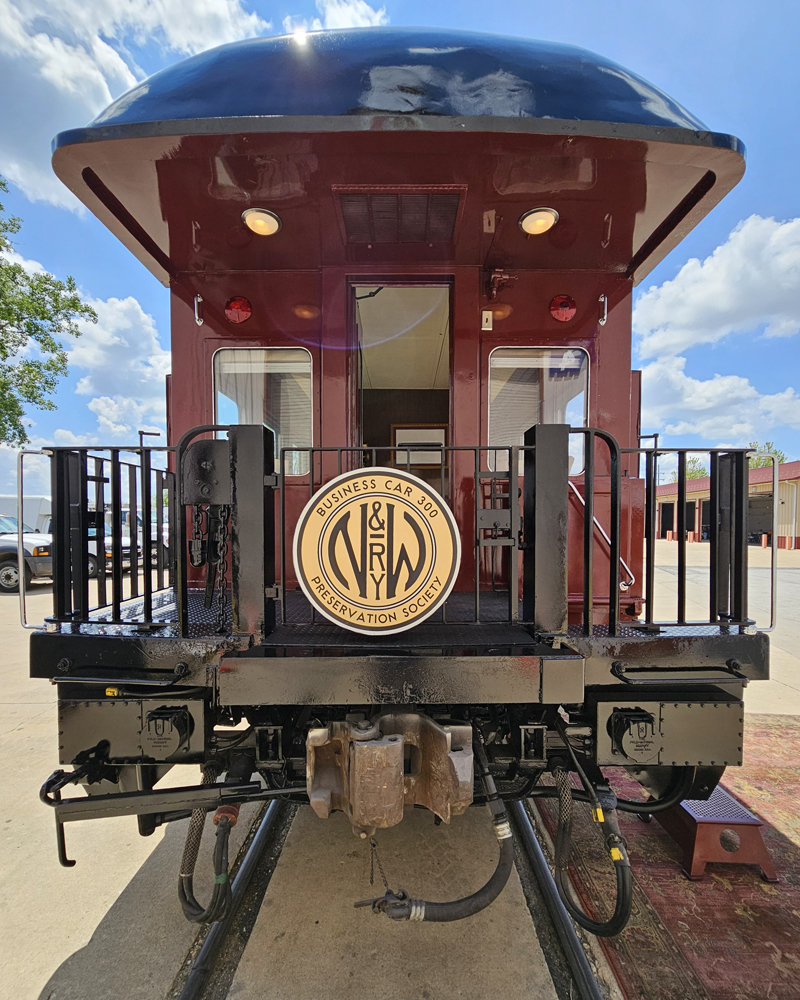 View of platform end of maroon passenger car