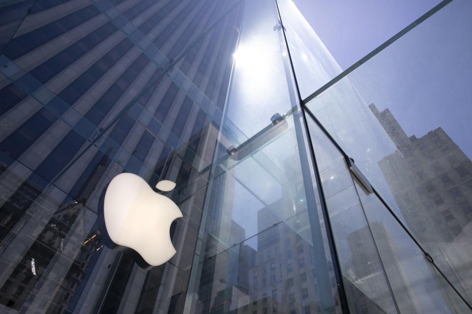 FILE - In this June 16, 2020, file photo, the sun reflects off the Apple store on Fifth Avenue in New York City.  Apple will report earnings on Thursday, May 2, 2024. (AP Photo/Mark Lennihan, File)