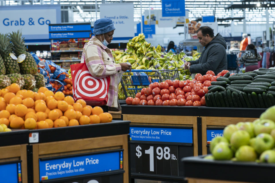 Customers purchase vegetables at the Walmart Supercenter in North Bergen, Thursday, Feb. 9, 2023, in New Jersey.  (AP Photo/Eduardo Muñoz Alvarez)