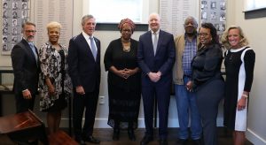 Panelists standing with Governor Carney and Department of Human Resources Secretary DeMatteis at the 70th anniversary event of Brown v. Board of Education.