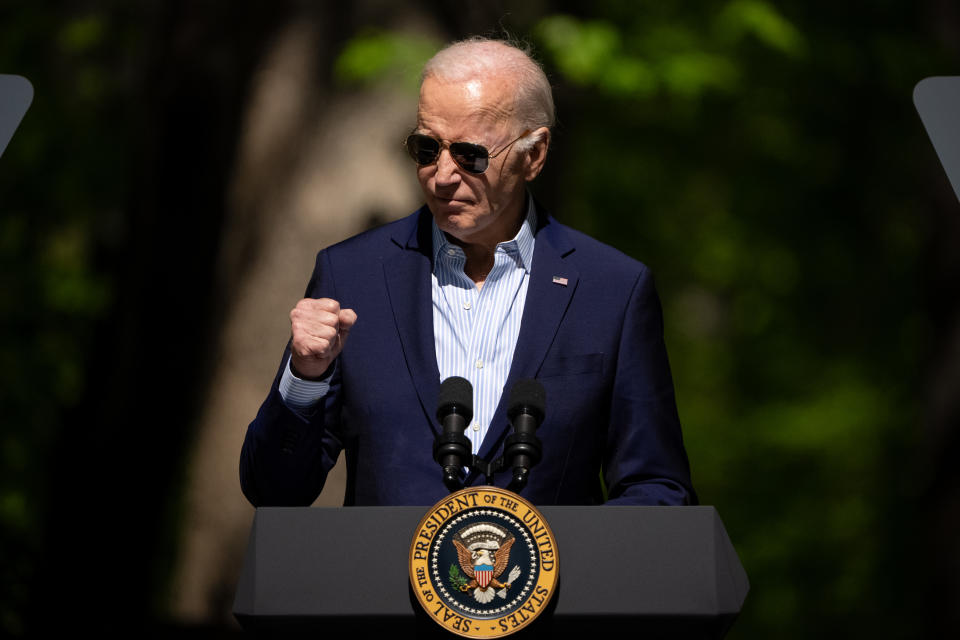 TRIANGLE, VIRGINIA - APRIL 22: US President Joe Biden raises his fist while speaking on Earth Day at Prince William Forest Park on April 22, 2024 in Triangle, Virginia.  Biden, along with Senators Bernie Sanders (D-VT), Edward Markey (D-MA) and Representative Alexandria Ocasio-Cortez (D-NY), announced a value of seven billion dollars 