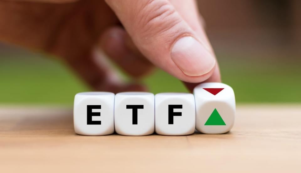 Blocks with the letters ETF with a green arrow pointing up.