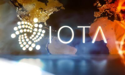 IOTA-logo-with-translucent-world-map-background.