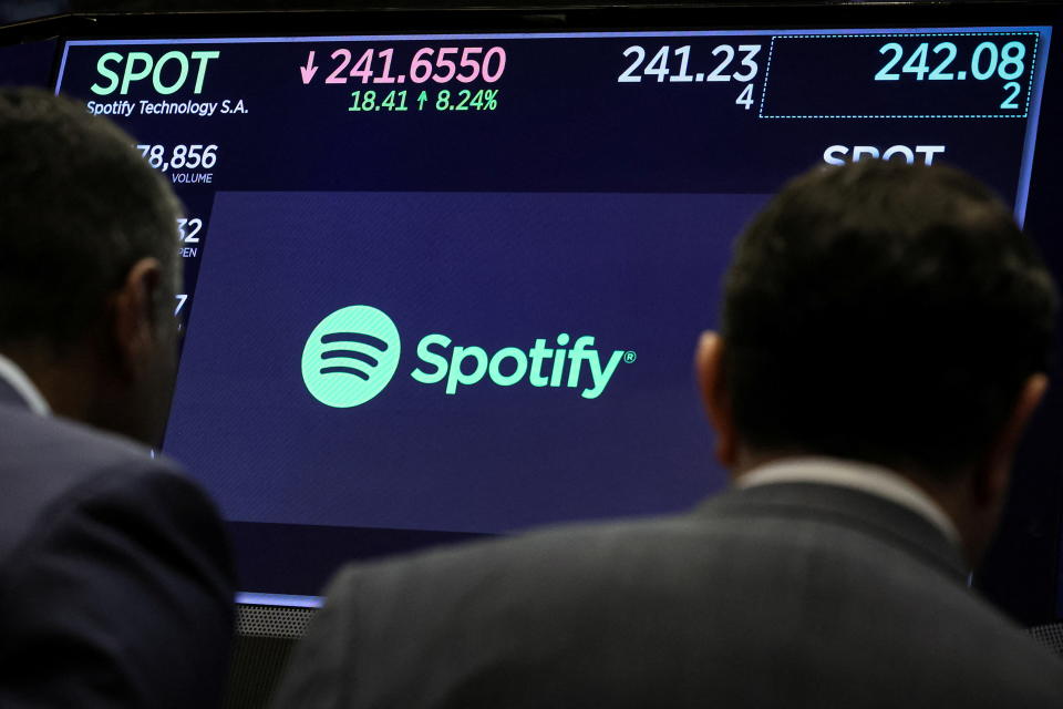 A screen displays Spotify's logo and business information on the floor of the New York Stock Exchange (NYSE) in New York City, U.S., on February 6, 2024. REUTERS/Brendan McDermid