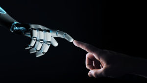 a robotic hand reaching out to a human hand on a black background, index fingers touching. robotic stocks to buy soon