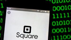 Square, Inc. (SQ) logo displayed on smartphone. Square, Inc. is a financial services, merchant services aggregator, and mobile payment company