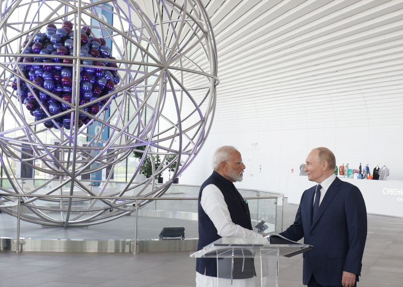 Russia talks business with India as Modi visits Moscow